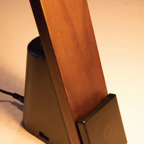 Close up of the Brooklyn LED USB Task Lamp in Black Walnut wood finish. The image shows the touch-activated dimming pad and the USB-A port. The USB-C port is on the other side.