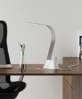 Brooklyn AC LED Task Lamp in a modern room setting with a desk and computer