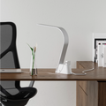 Brooklyn AC LED Task Lamp in a modern room setting with a desk and computer