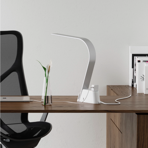 Brooklyn AC LED Task Lamp in a modern room setting with a desk and computer