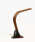 Rear view of the modern wooden Brooklyn USB LED Task Lamp in Black Walnut finish, with USB charging on a white background. The light is shown with the optional stabilizing base. 