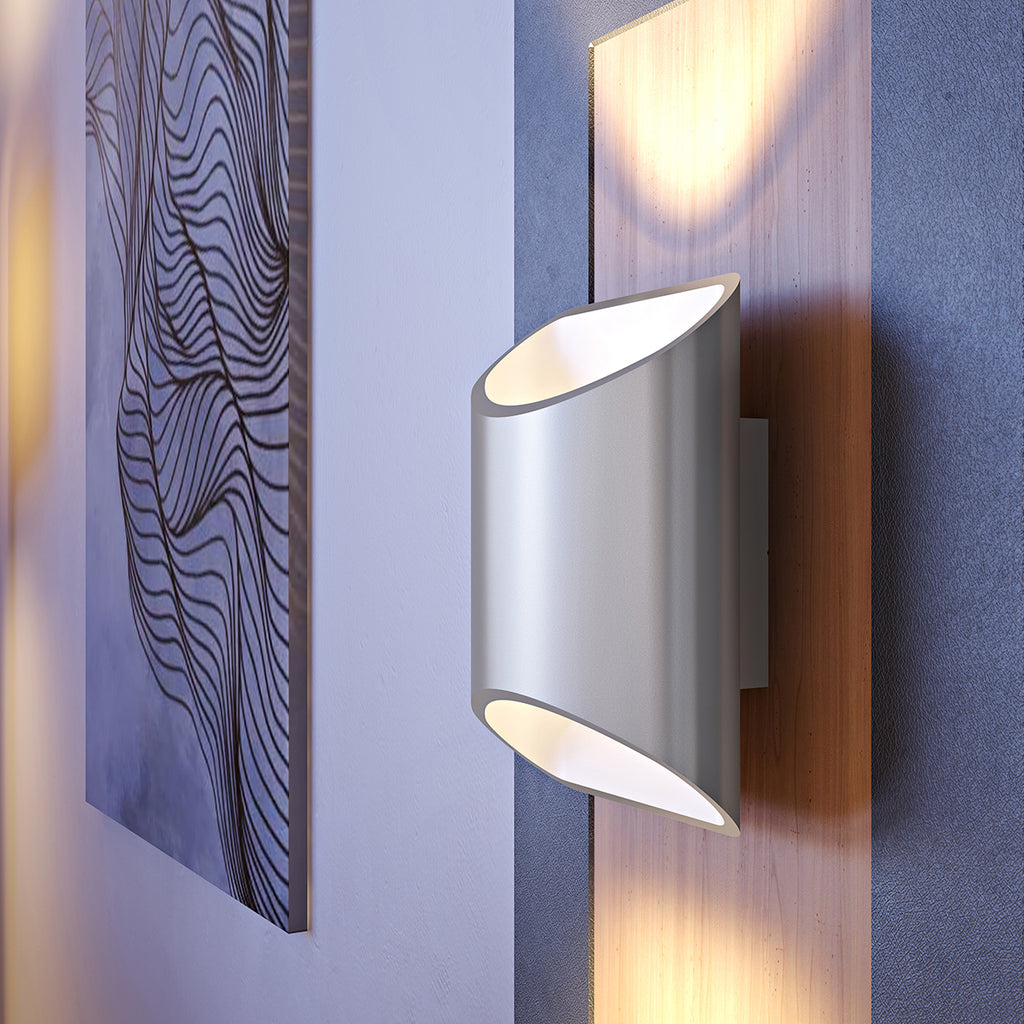 Close view of a brushed aluminum Brooklyn LED wall sconce mounted on a wall