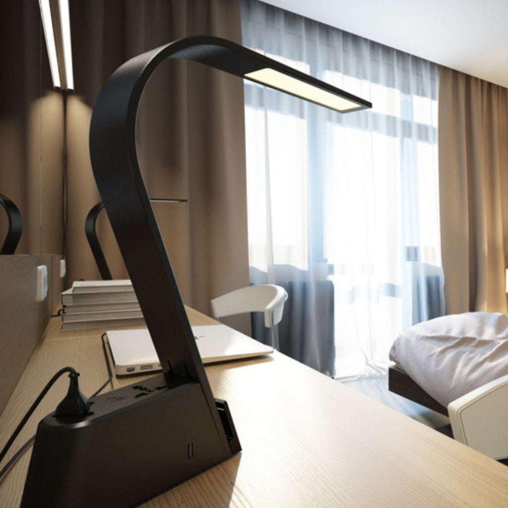 Brooklyn AC - LED Task Lamp on a table in a hotel room.